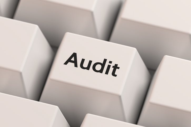 audit printed on computer keyboard key