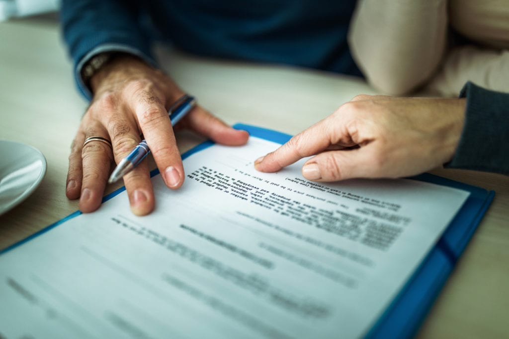 pointing where to sign on contract